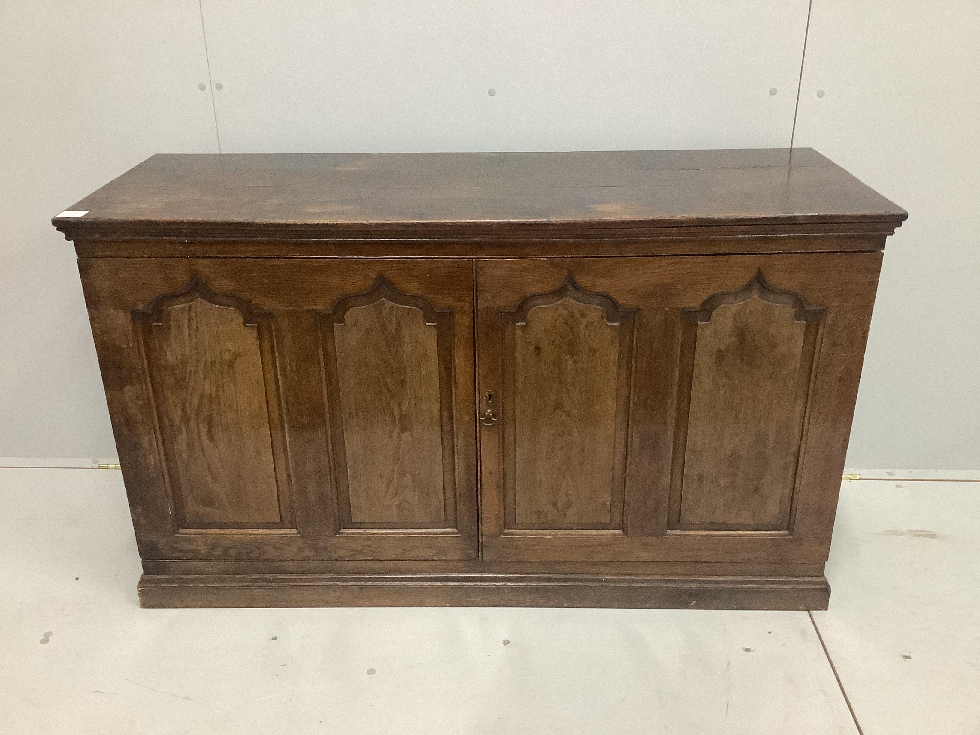 An 18th century and later oak side cabinet, width 134cm, depth 48cm, height 79cm